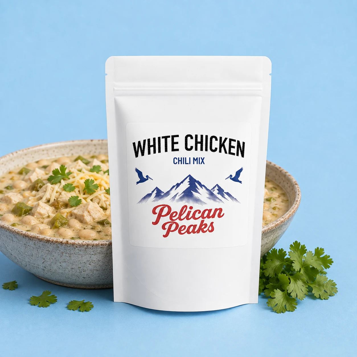 Pelican Peaks White Chicken Chili Mix with a bowl of prepared white chicken chili